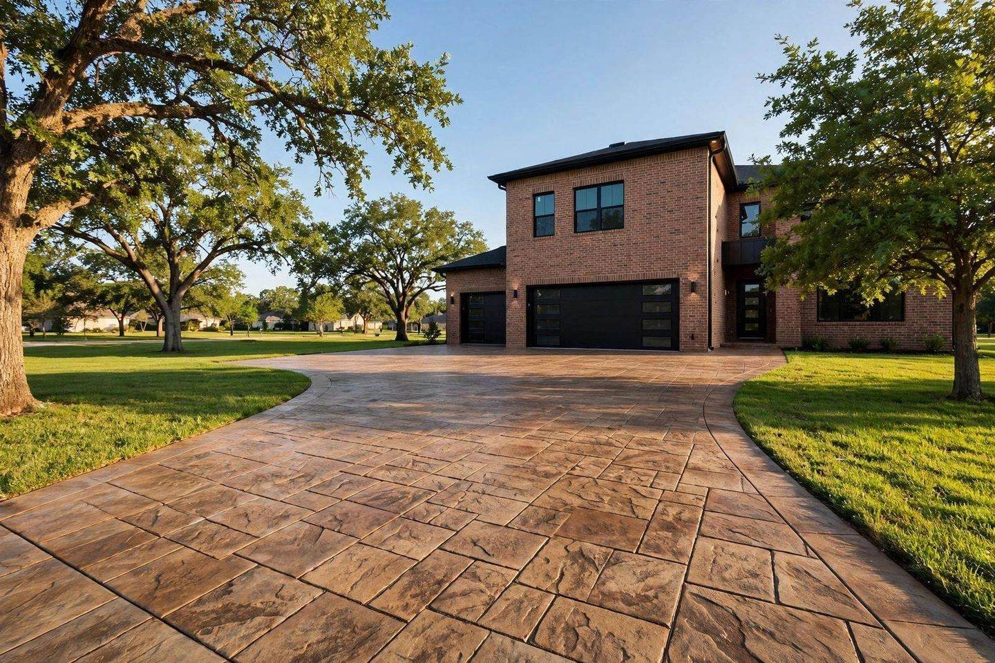 Stamped concrete driveway leading up to a Houston home